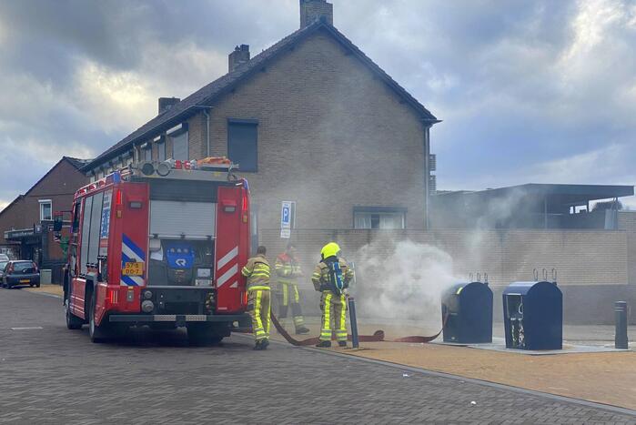 Ondergrondse container in brand