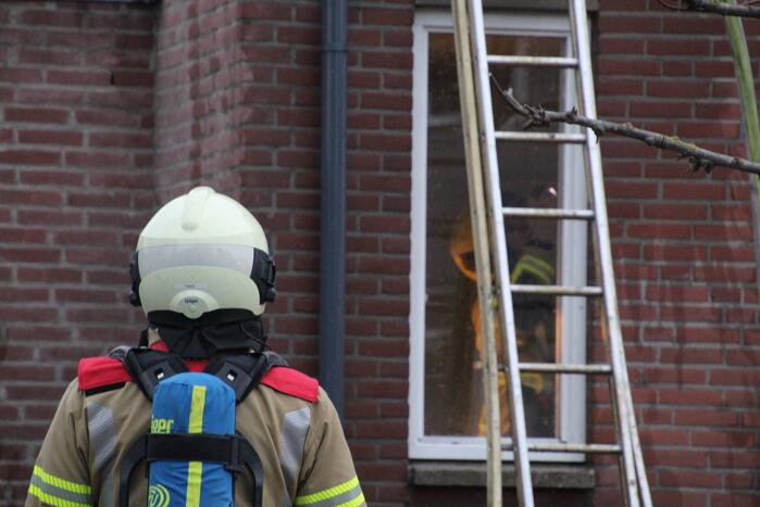 Brand in afzuigkap van woning