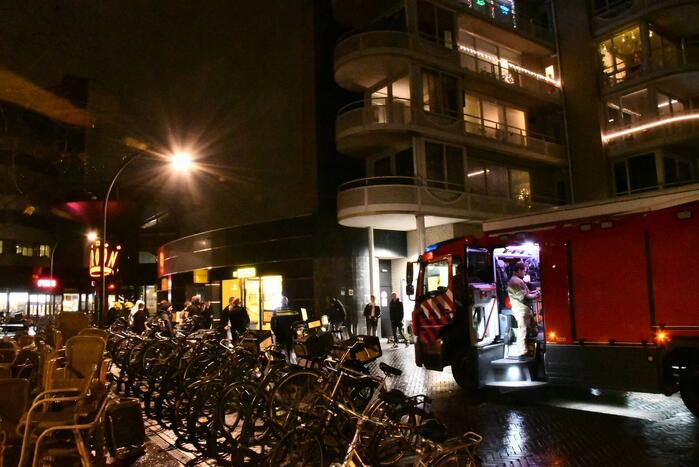 Brandweer blust brand in wasdroger