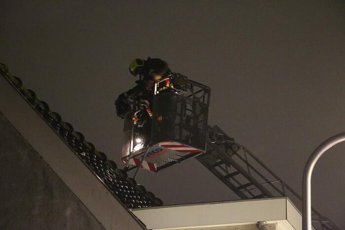 Rookontwikkeling door brand in schoorsteen van woning
