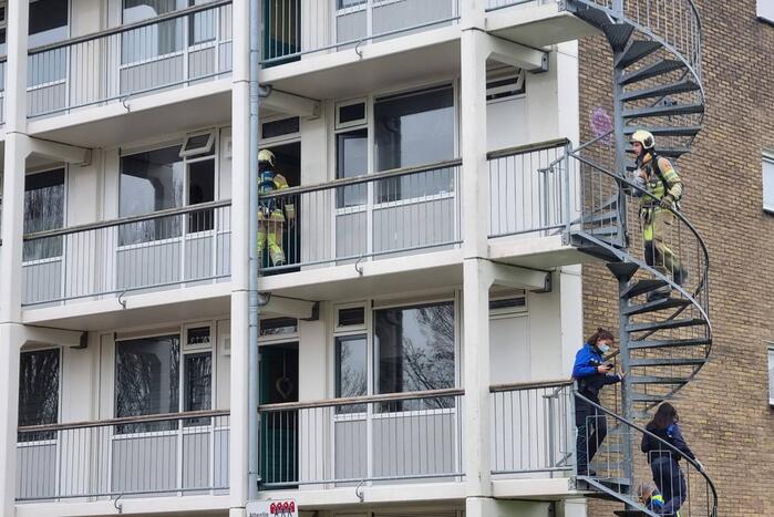 Brand in keuken van flatwoning