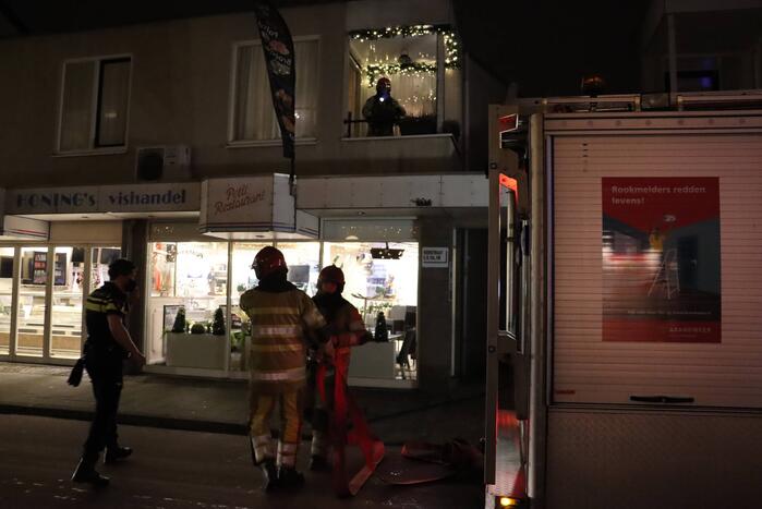 Korte felle wasmachinebrand in bovenwoning