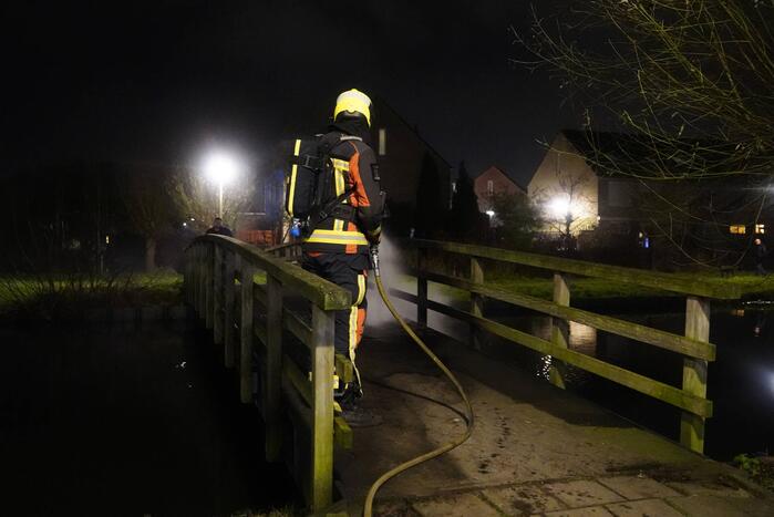Brandstichting op houten brug