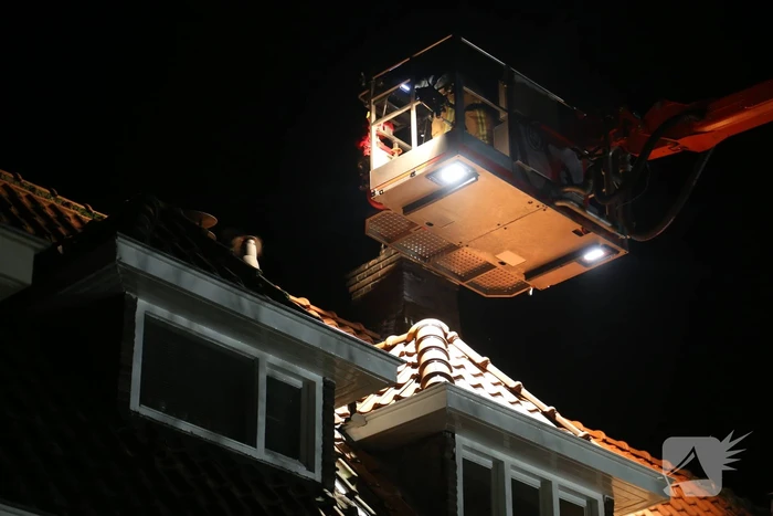 Brand in schoorsteen van woning