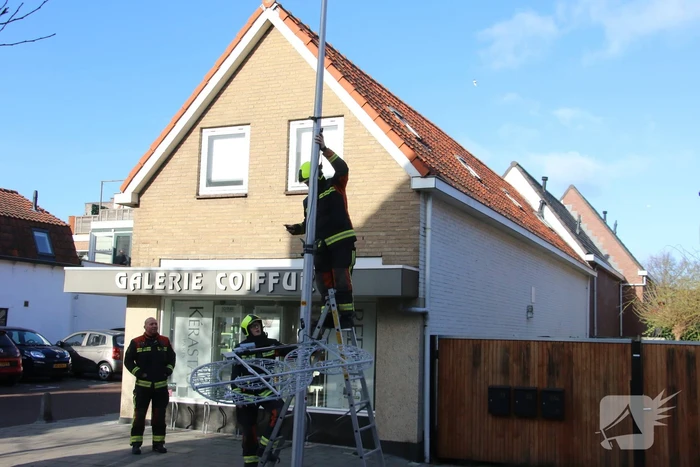 Sierverlichting verwijderd door de brandweer