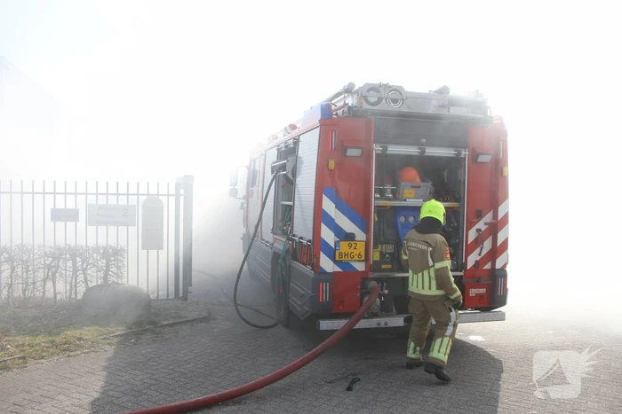 Forse rookontwikkeling bij brand in container