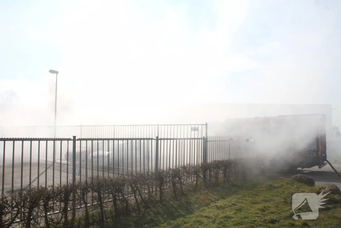 Forse rookontwikkeling bij brand in container