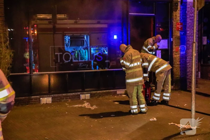 Rookontwikkeling vanwege brand in restaurant Tollius