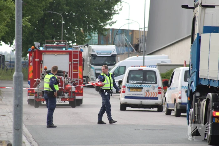 Brand in loods met papier