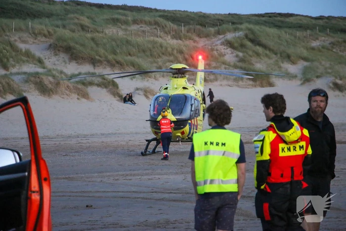 Hardloper onwel op strand
