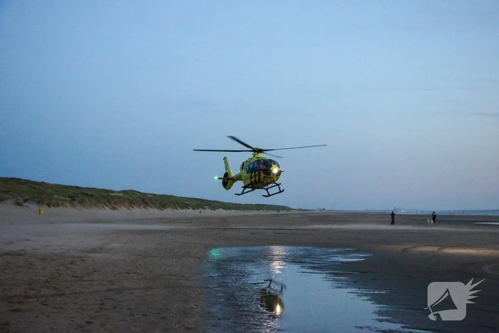 Hardloper onwel op strand