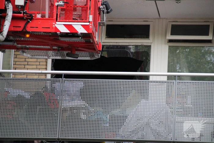 Hevige brand in portiekwoning