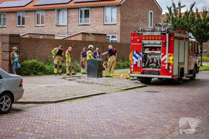 Ondergrondse container in brand