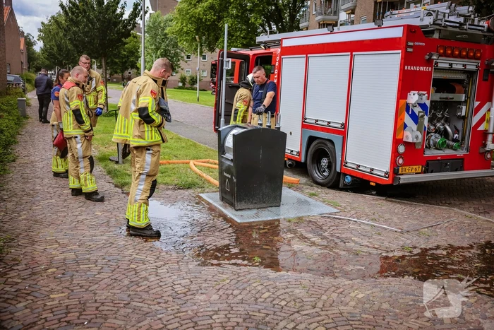 Ondergrondse container in brand
