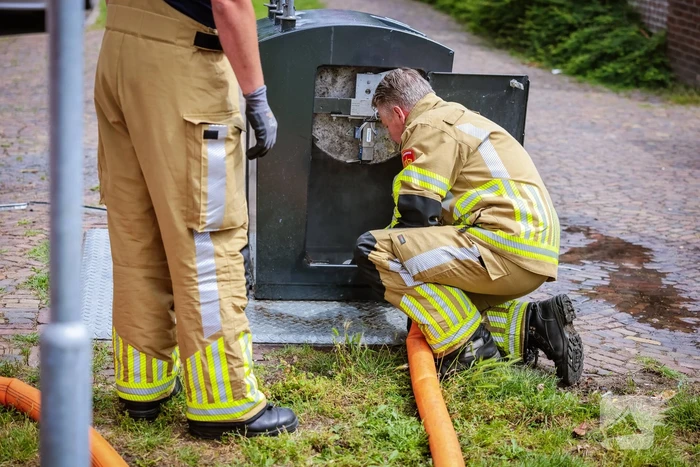 Ondergrondse container in brand