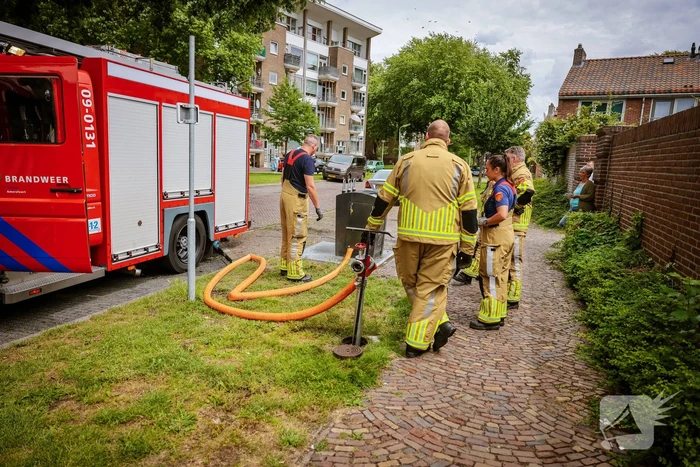 Ondergrondse container in brand