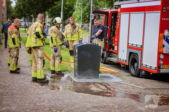 Ondergrondse container in brand
