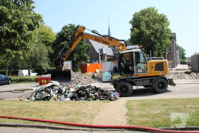 Lading vuilniswagen vat vlam