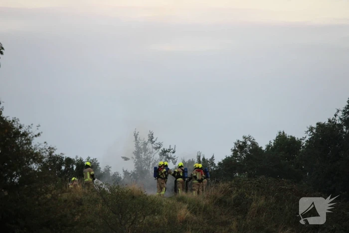 Pallets boven op berg in brand gevlogen
