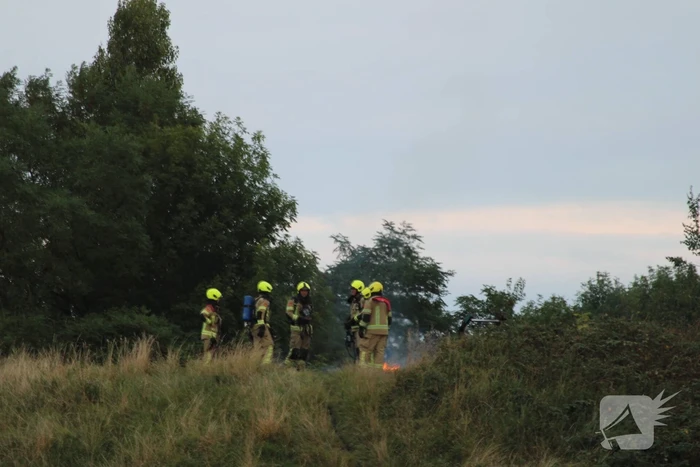 Pallets boven op berg in brand gevlogen