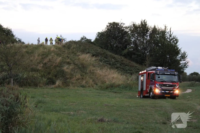 Pallets boven op berg in brand gevlogen