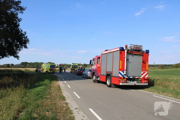 Scootmobiel en racefietser botsen op elkaar