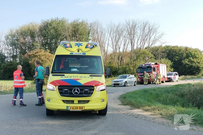 Scootmobiel en racefietser botsen op elkaar