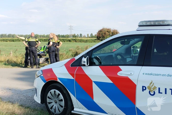 Scootmobiel en racefietser botsen op elkaar