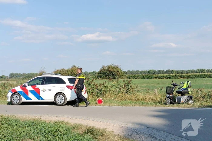 Scootmobiel en racefietser botsen op elkaar
