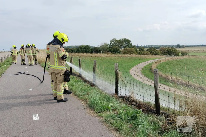 Afrastering beschadigd vanwege brand