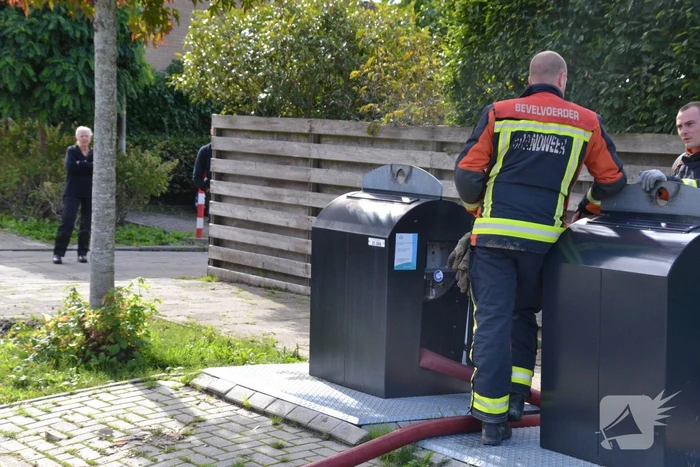 Ondergrondse container in brand