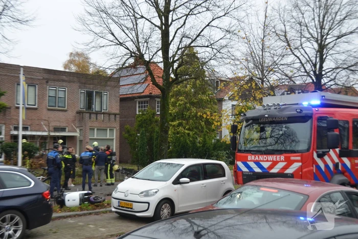Prullenbak vat vlam in woning