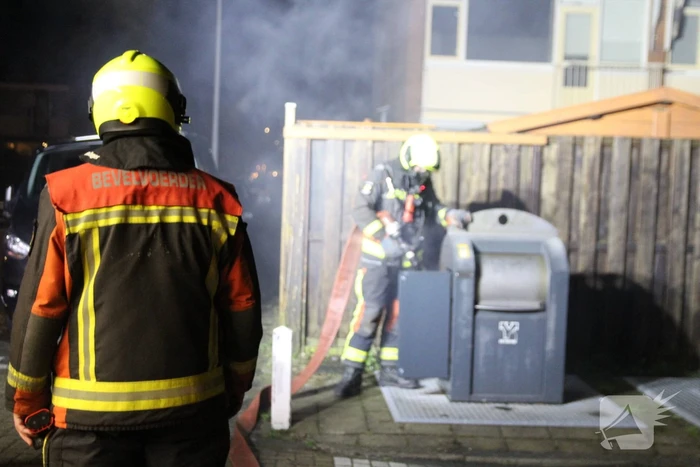 Ondergrondse container in brand