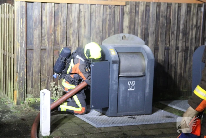 Ondergrondse container in brand