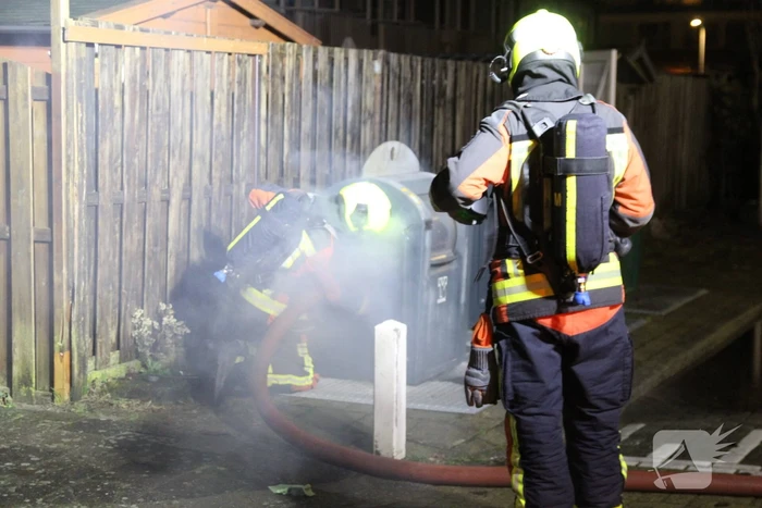 Ondergrondse container in brand