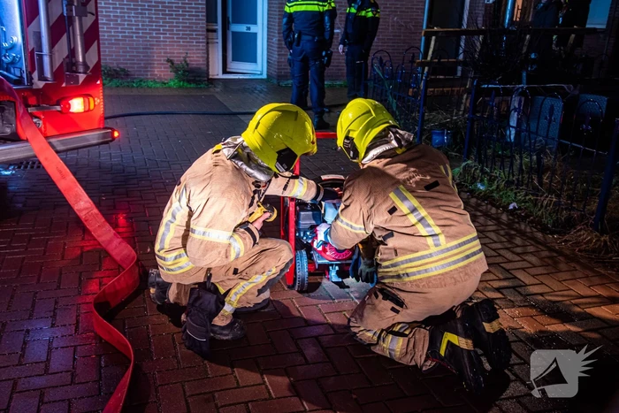 Buurman ontdekt brand in woning van buren