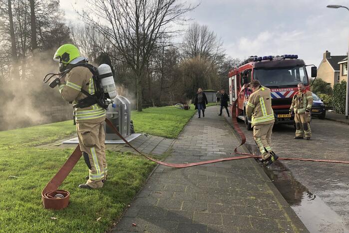 Zak met as zorgt voor containerbrand