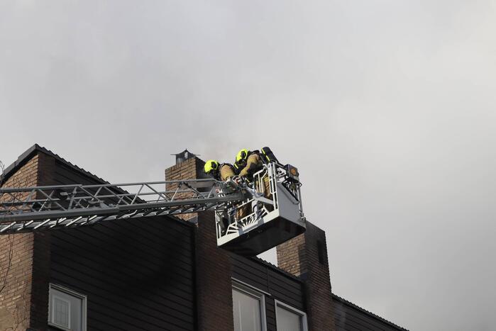 Veel rook bij brand in schoorsteen