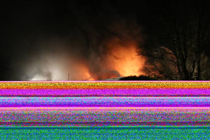 Grote uitslaande brand in bedrijfspand