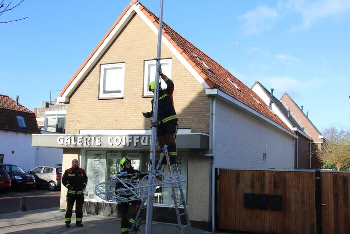 Sierverlichting verwijderd door de brandweer