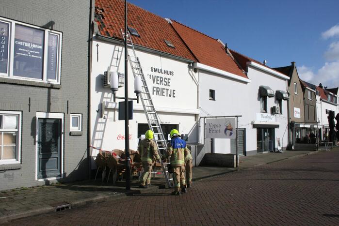 Brandweer ingezet voor stormschades in winkelgebied