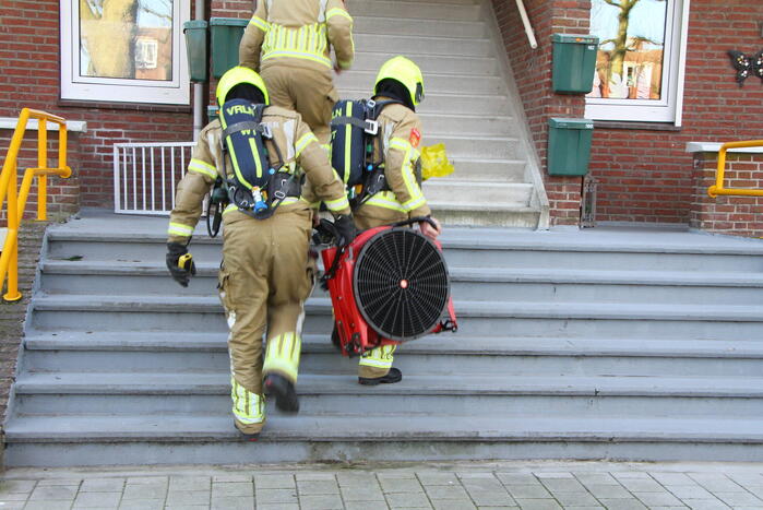 Omwonenden zien rook in portiekwoning