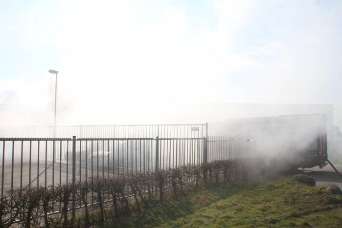 Forse rookontwikkeling bij brand in container