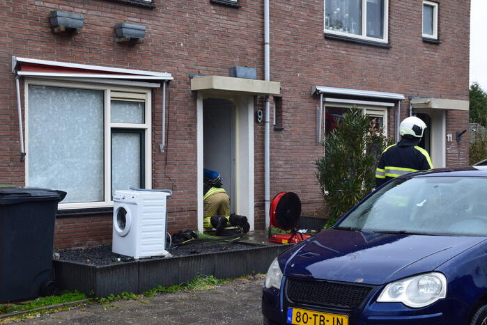 Wasmachine in woning vat vlam