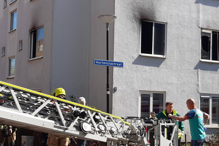 Brand in slaapkamer van portiekwoning