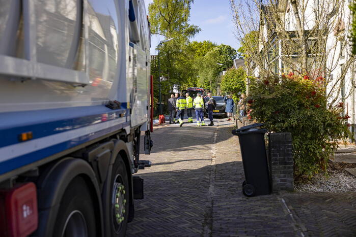 Vuilnisman raakt gewond bij blusactie