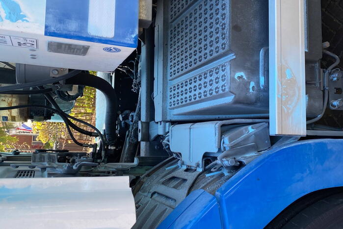 Vuilnisman raakt gewond bij blusactie