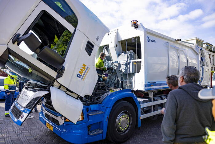 Vuilnisman raakt gewond bij blusactie