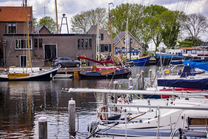 Schipper redt persoon uit het water