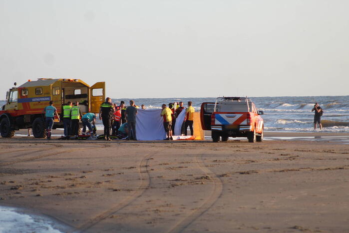 Hardloper onwel op strand